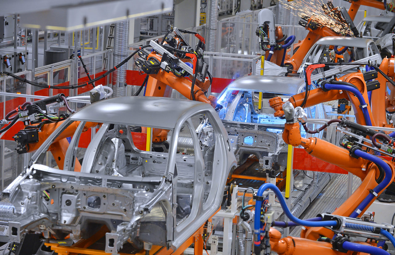 Robotic arms in an automobile factory